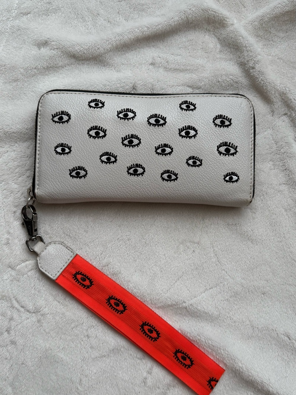 Min & Mon White Wallet with Black Eye Motif and Orange Wrist Strap